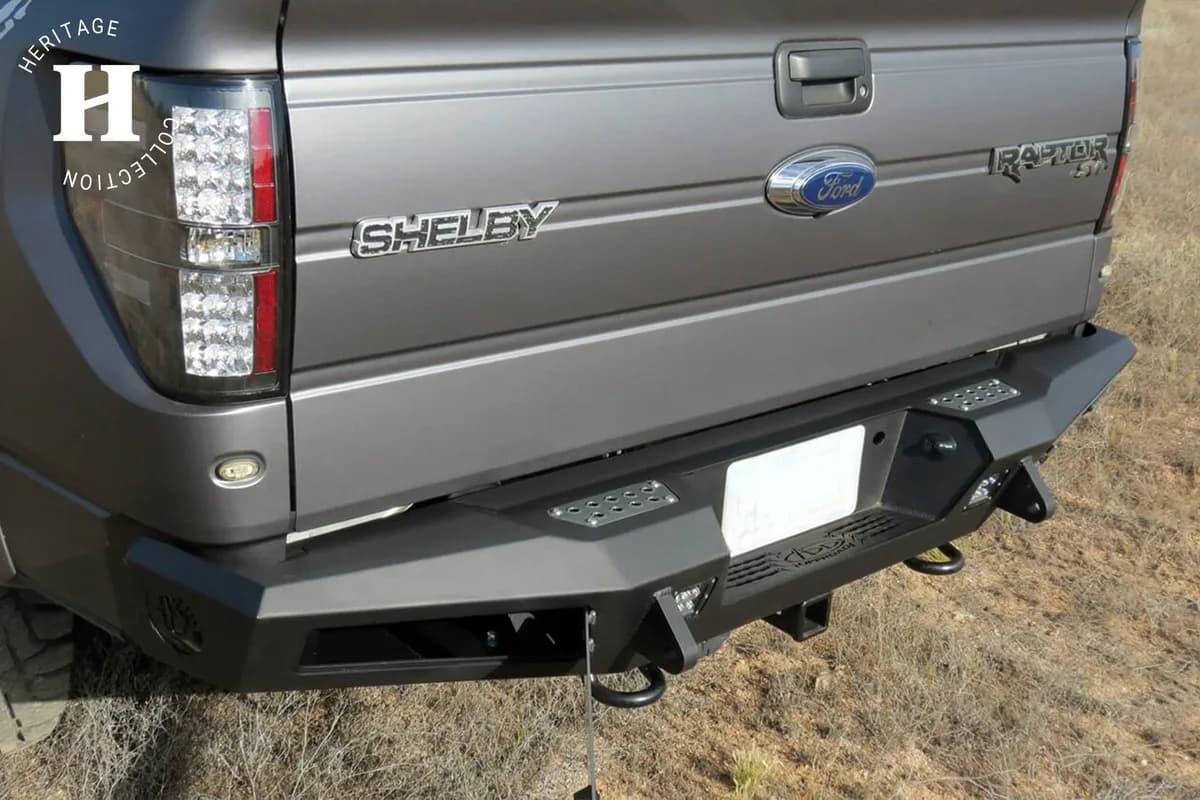 2010 - 2014 Ford Raptor 2009 - 2014 Ford F-150 2011 - 2014 Ford Ecoboost F-150 HoneyBadger Rear Bumper with Integrated Storage Box and Backup Sensor cutouts with Dually mounts in Hammer Black with Satin Black panels.