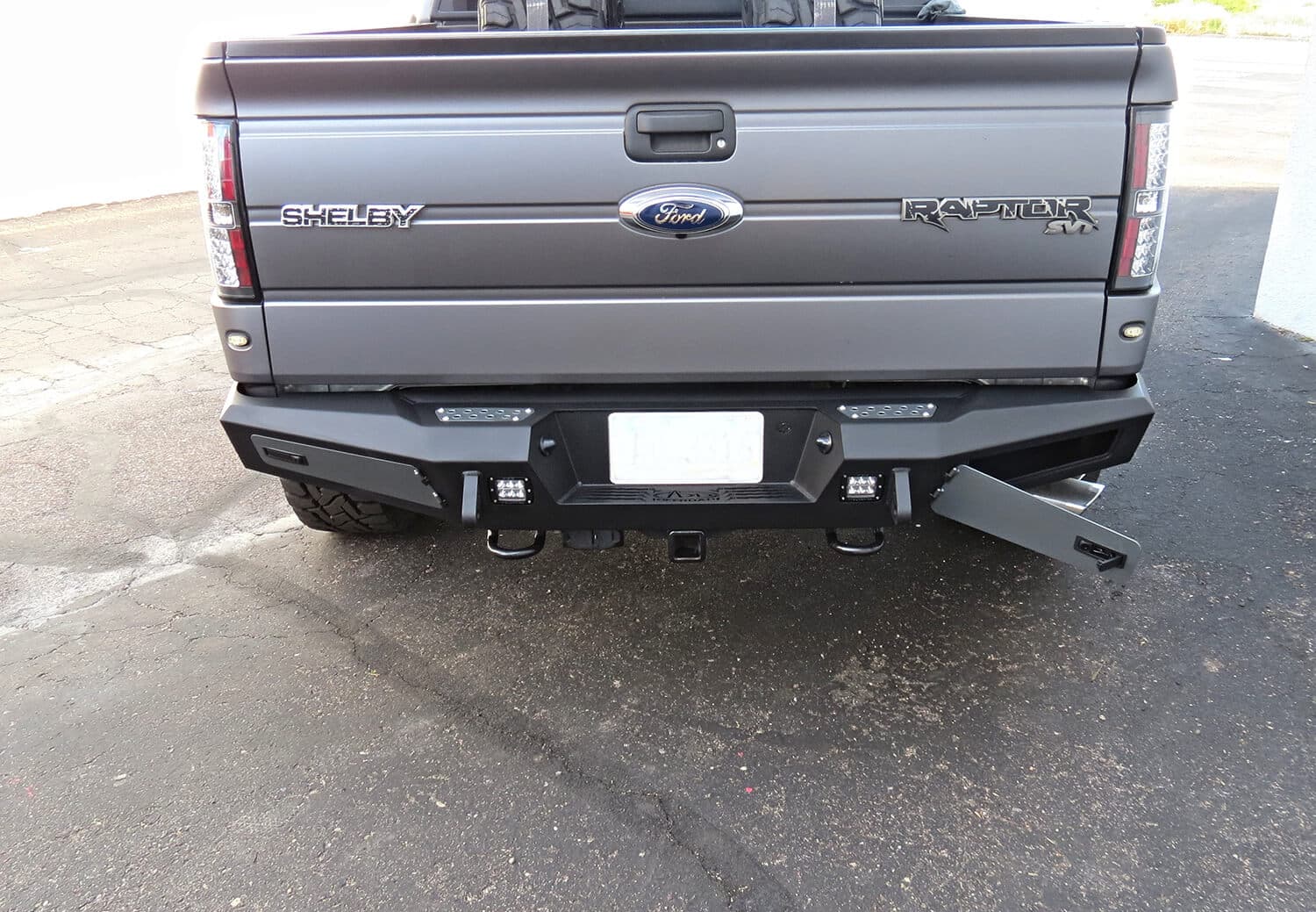 2010 - 2014 Ford Raptor 2009 - 2014 Ford F-150 2011 - 2014 Ford Ecoboost F-150 HoneyBadger Rear Bumper with Integrated Storage Box and Backup Sensor cutouts with Dually mounts in Hammer Black with Satin Black panels. product image