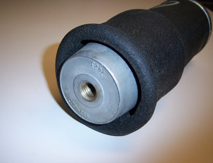 Ridetech Firestone 7012 Rolling Sleeve Air Spring 5 Inch Diameter W/ 1/8 Inch NPT Port Length Is 4 Inch Minimum 7 -8 Inch Ride Height And 13 Inch Maximum Load Capacity Is 1000 LbsAt 100 Psi Ridetech